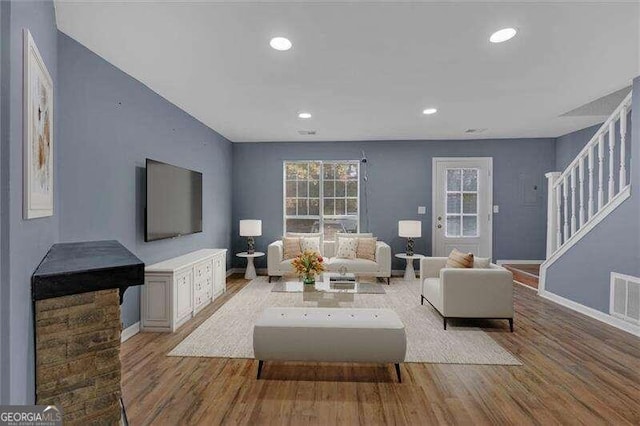 living room with light hardwood / wood-style floors