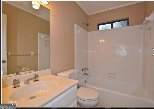 bathroom with tile patterned floors, ornamental molding, and toilet