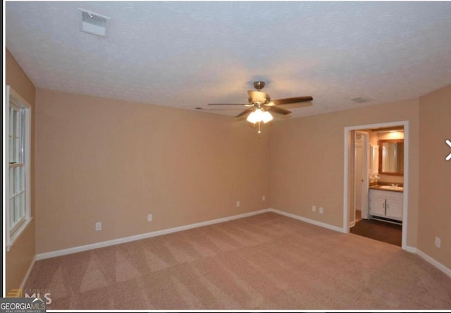 interior space featuring a textured ceiling and ceiling fan