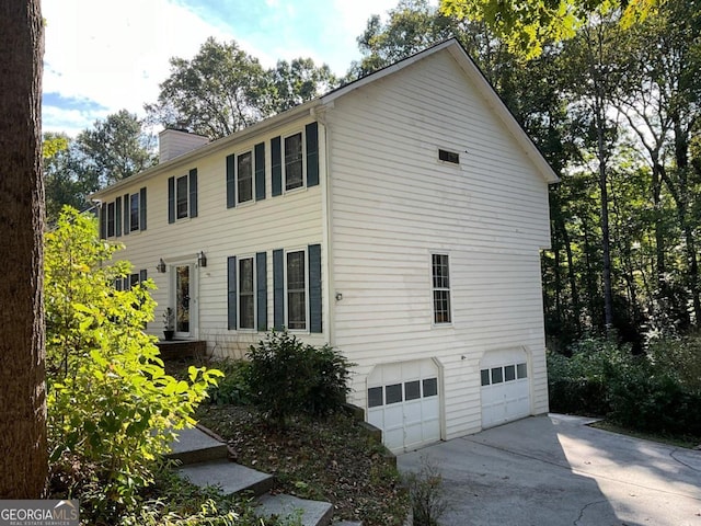 view of property exterior with a garage