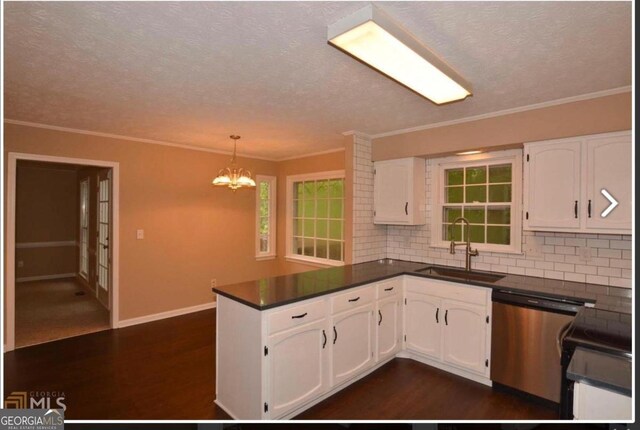 kitchen featuring tasteful backsplash, sink, stainless steel appliances, and white cabinets