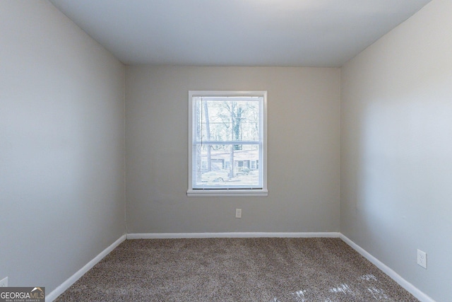 unfurnished room featuring carpet floors