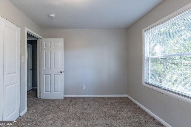 empty room featuring carpet flooring