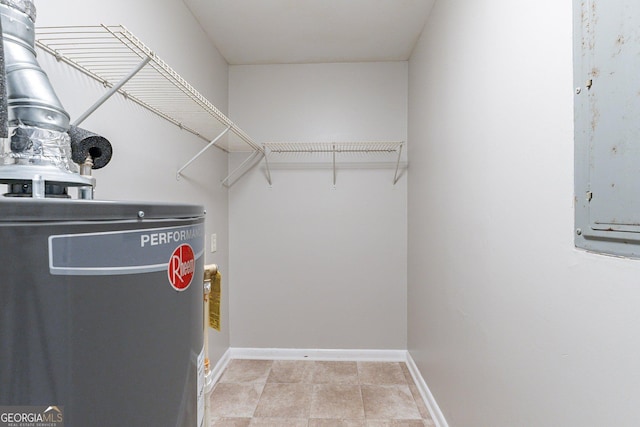 spacious closet with gas water heater and electric panel