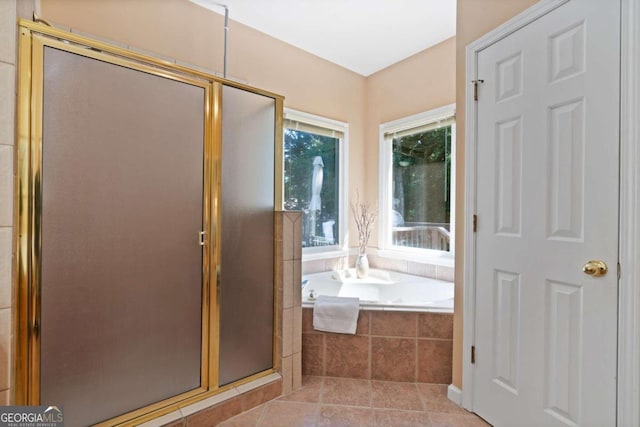 bathroom with tile patterned floors and separate shower and tub