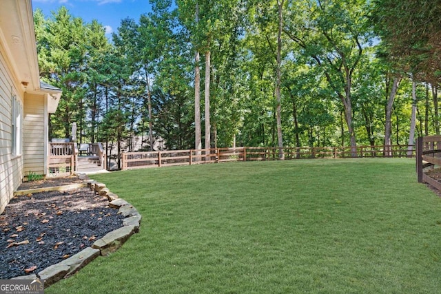 view of yard with a deck