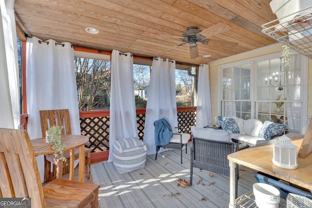 sunroom with wood ceiling, ceiling fan, and a wealth of natural light