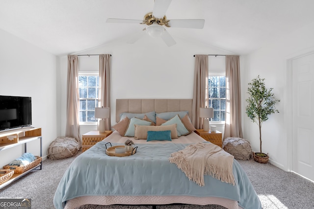 bedroom with lofted ceiling, ceiling fan, and carpet