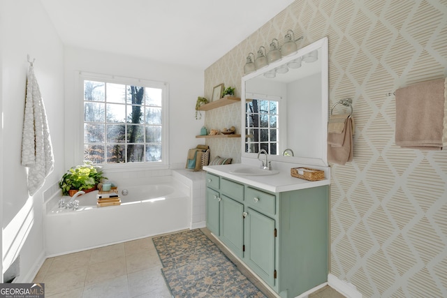 bathroom with vanity, a tub to relax in, and tile patterned floors