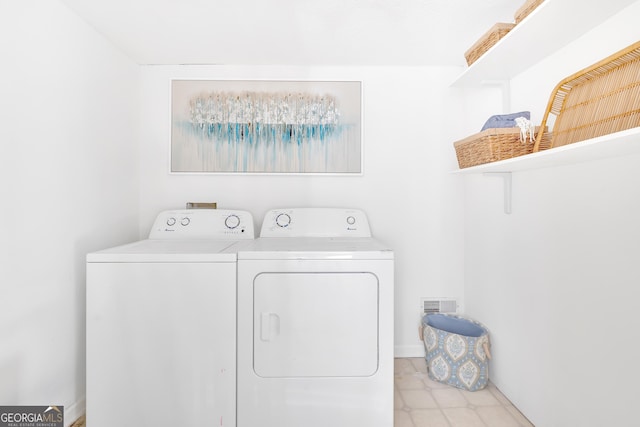 laundry room with separate washer and dryer