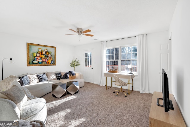 living room featuring ceiling fan and light colored carpet