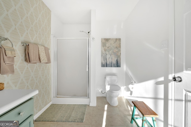 bathroom with tile patterned flooring, toilet, vanity, and a shower with shower door