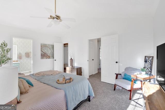 bedroom with ceiling fan, lofted ceiling, connected bathroom, and carpet