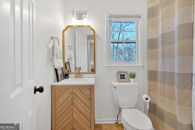 bathroom with vanity and toilet