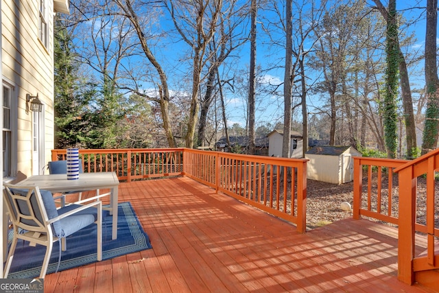 wooden terrace featuring a shed