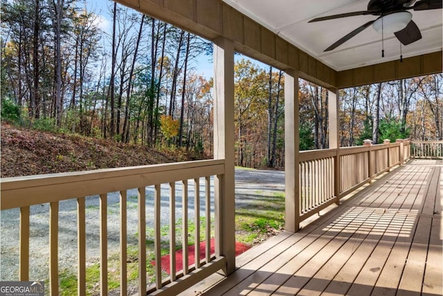 deck featuring a porch and ceiling fan