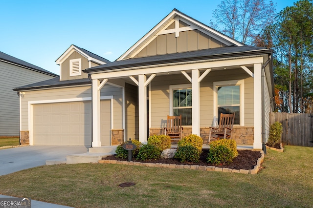 view of front of property with covered porch and a front lawn