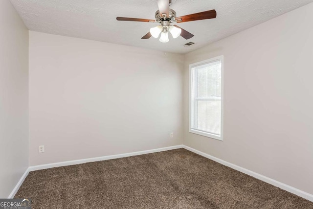 empty room featuring carpet flooring, ceiling fan, and a textured ceiling