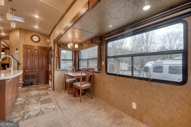 interior space with an inviting chandelier and sink