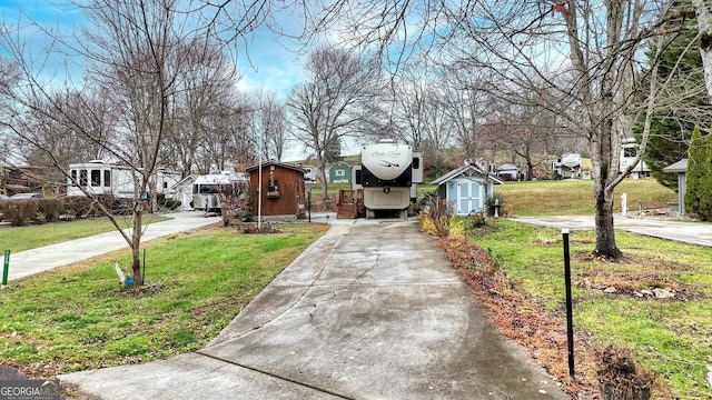 exterior space featuring concrete driveway