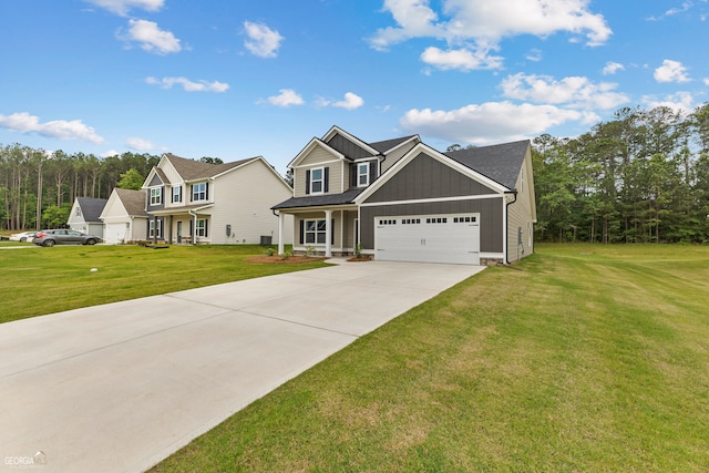 view of front facade with a porch, a front yard, and a garage