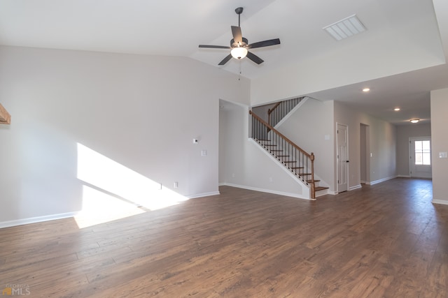 unfurnished living room featuring lofted ceiling, ceiling fan, and dark wood-type flooring