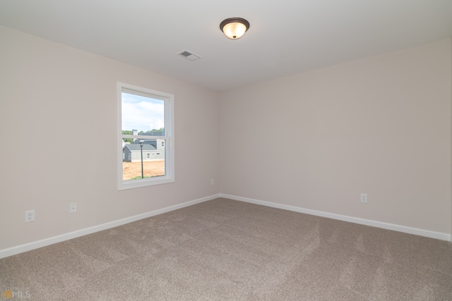 spare room featuring carpet floors