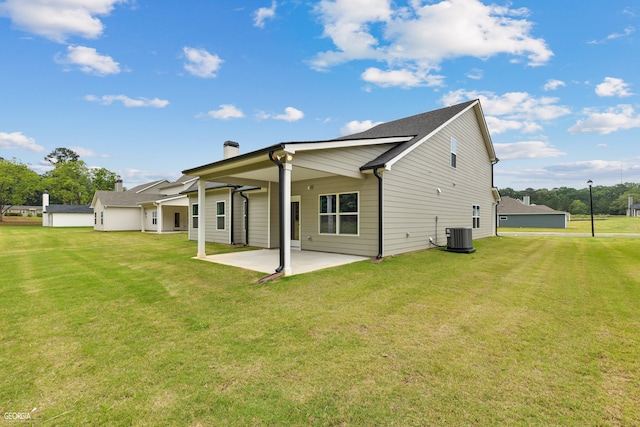 back of property featuring a yard and a patio area