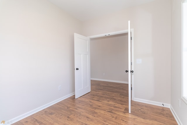 empty room featuring wood-type flooring