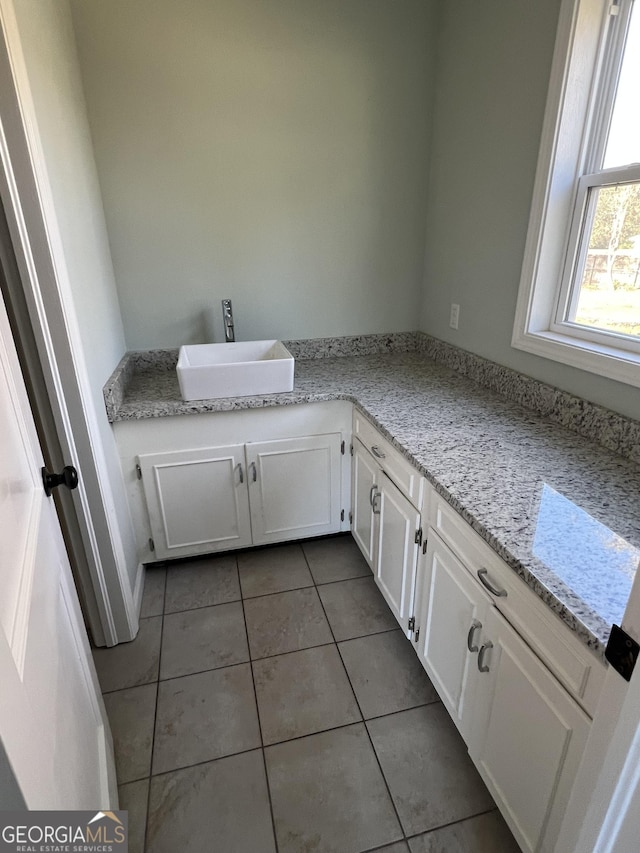 bathroom featuring tile patterned floors and sink