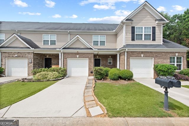 view of front of property with a front lawn and a garage