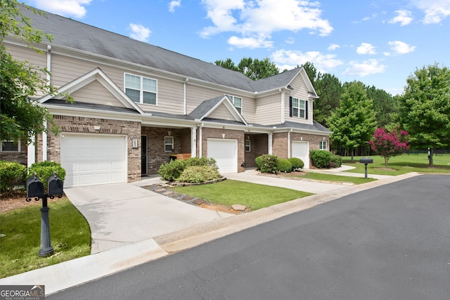 view of front of house featuring a garage and a front lawn