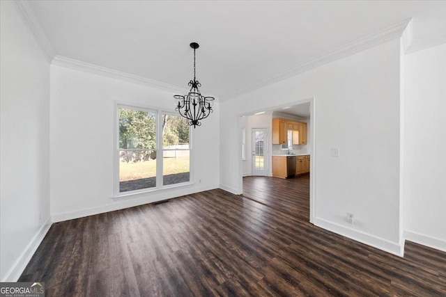 unfurnished dining area with ornamental molding, dark wood-type flooring, and a notable chandelier