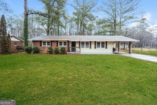 ranch-style house with a carport and a front lawn