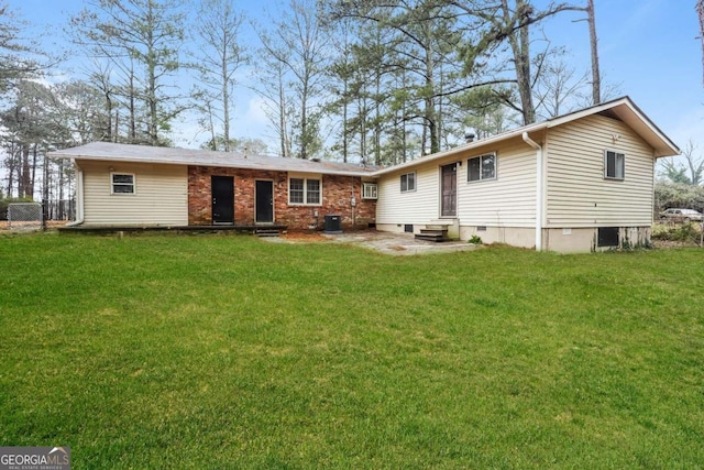 back of house with a lawn