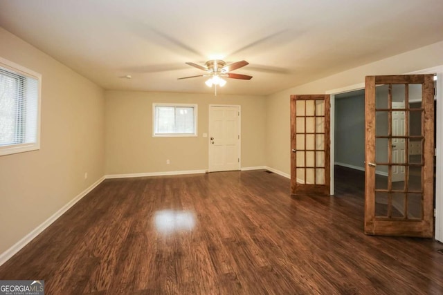 unfurnished room with french doors, dark hardwood / wood-style floors, and ceiling fan