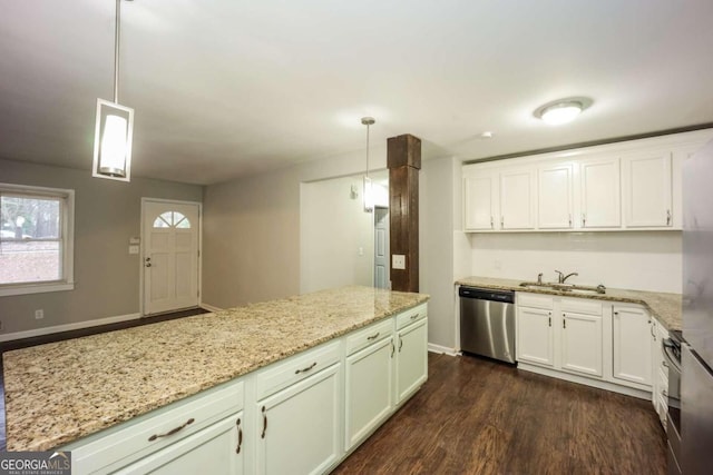 kitchen featuring dishwasher, sink, dark hardwood / wood-style floors, decorative light fixtures, and light stone counters