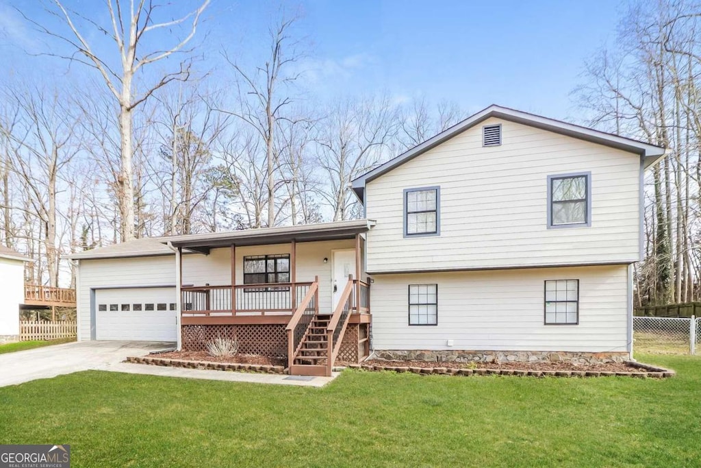 split level home with a front lawn and a porch