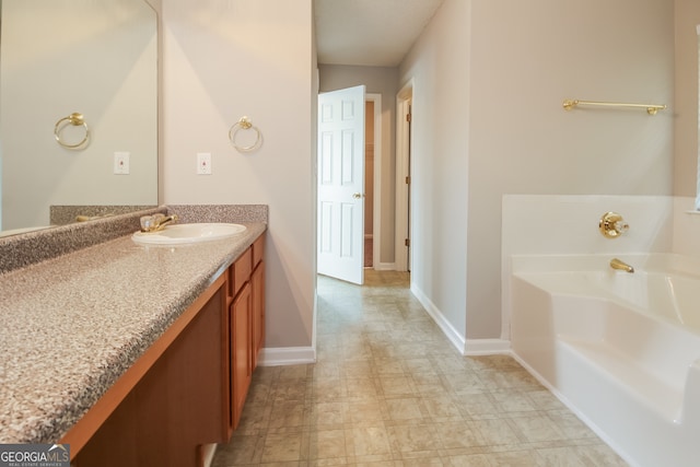 bathroom featuring a bathing tub and vanity