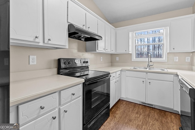 kitchen with vaulted ceiling, white cabinetry, sink, stainless steel dishwasher, and black electric range