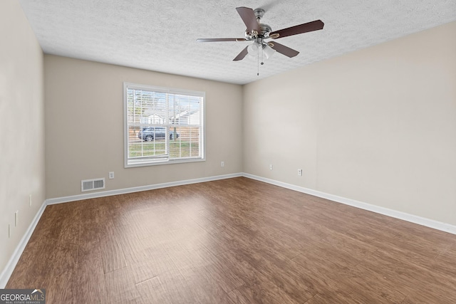 unfurnished room with hardwood / wood-style flooring, ceiling fan, and a textured ceiling