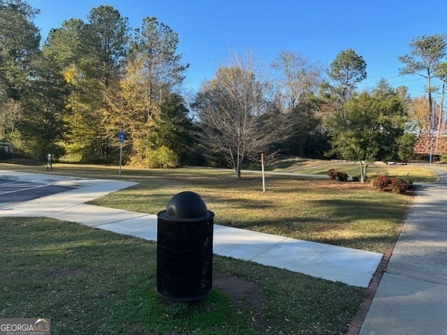 view of property's community with a yard