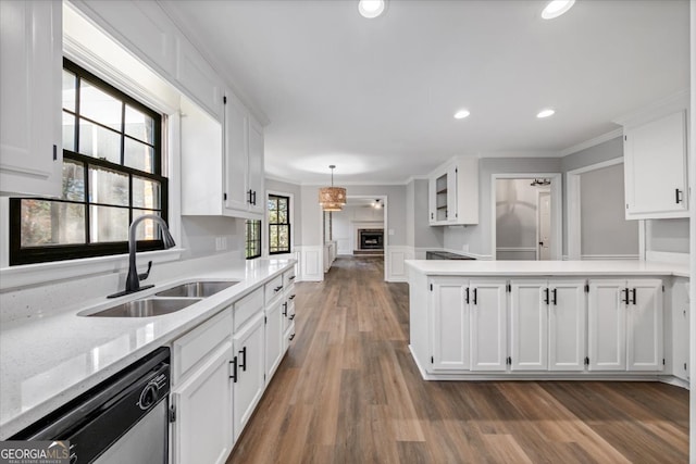 kitchen featuring dishwasher, white cabinetry, dark wood-type flooring, and sink