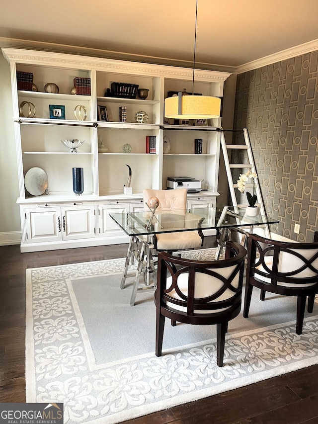 dining room with dark wood-type flooring and crown molding