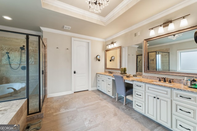 bathroom with an inviting chandelier, a tray ceiling, ornamental molding, shower with separate bathtub, and vanity