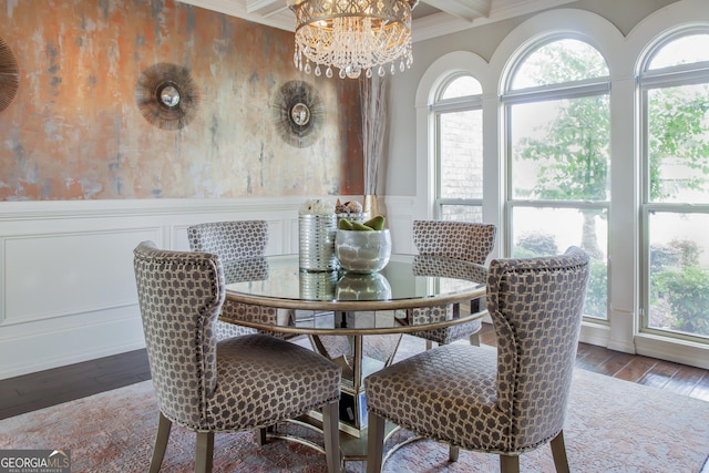 dining area with a healthy amount of sunlight, ornamental molding, and beam ceiling