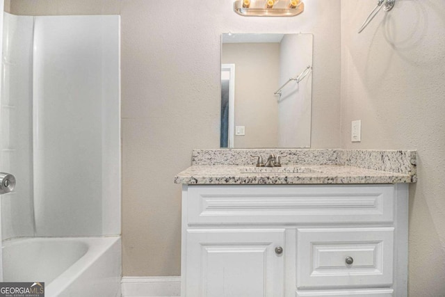 bathroom featuring shower / bathing tub combination and vanity