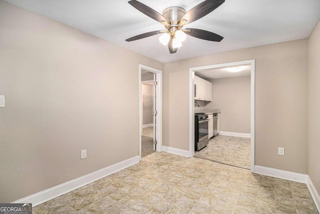 interior space with ceiling fan