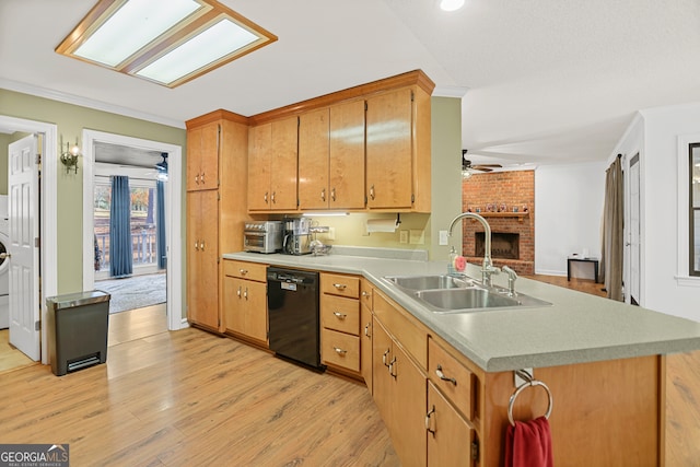 kitchen featuring sink, ceiling fan, black dishwasher, light hardwood / wood-style floors, and kitchen peninsula