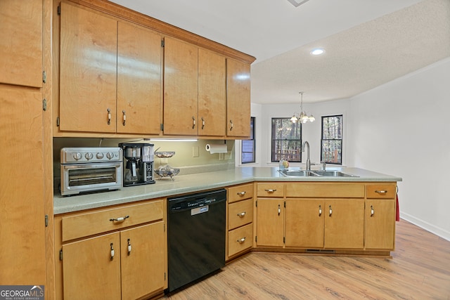 kitchen featuring dishwasher, sink, hanging light fixtures, kitchen peninsula, and light hardwood / wood-style floors